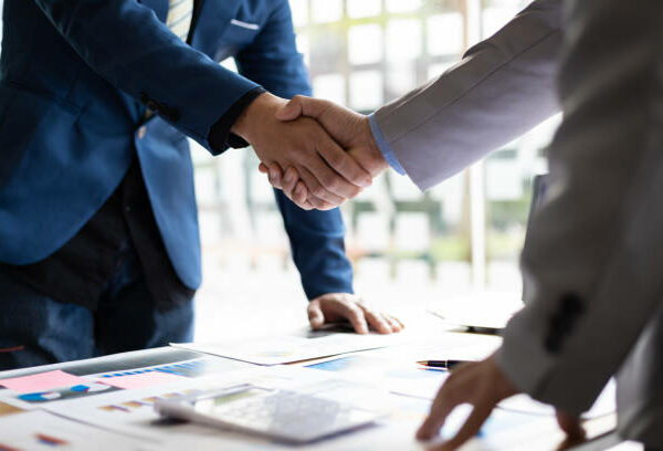 Business partner handshake after the meeting. Financial and investment cooperation.